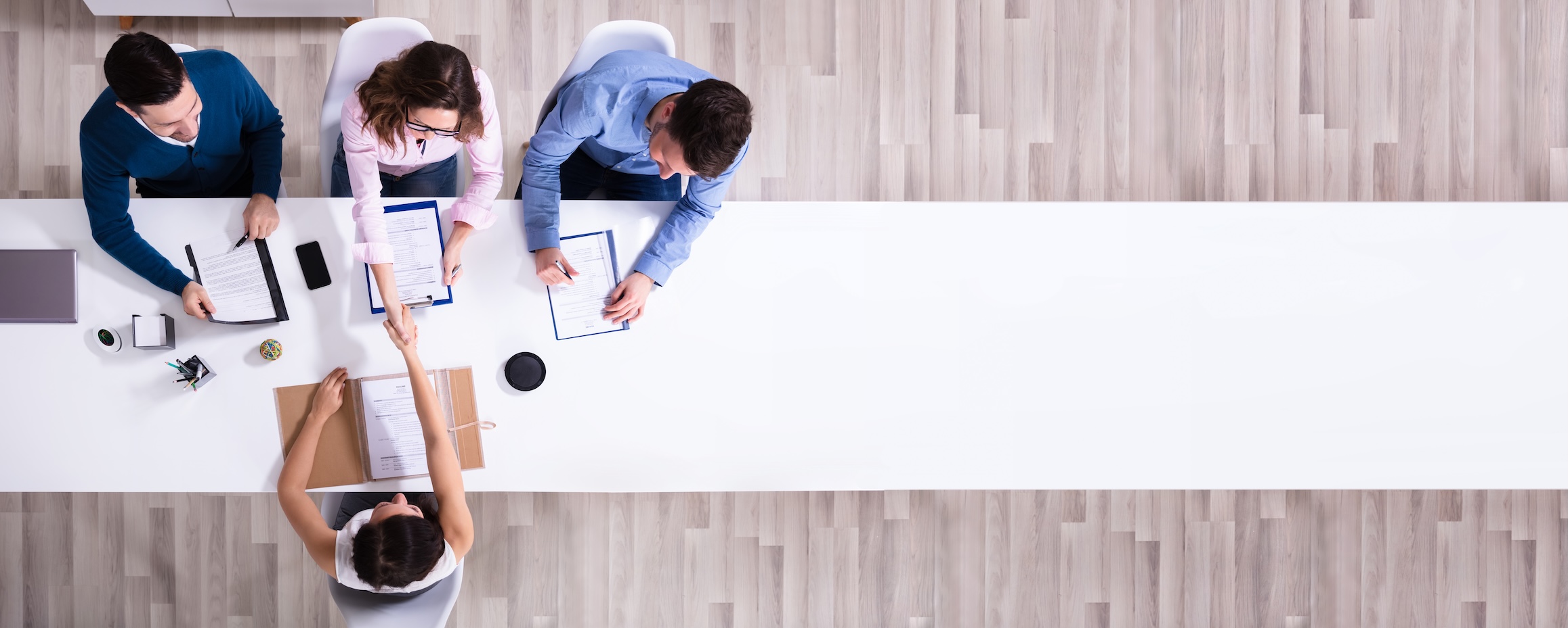 Top view image three people interviewing a person for a job interview